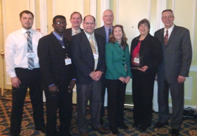 Photo of MnDOT employees receiving award from the Concrete Pavement Association.